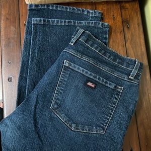 34x32 Dickies Dar blue jeans with some wear color on one pocket / defects